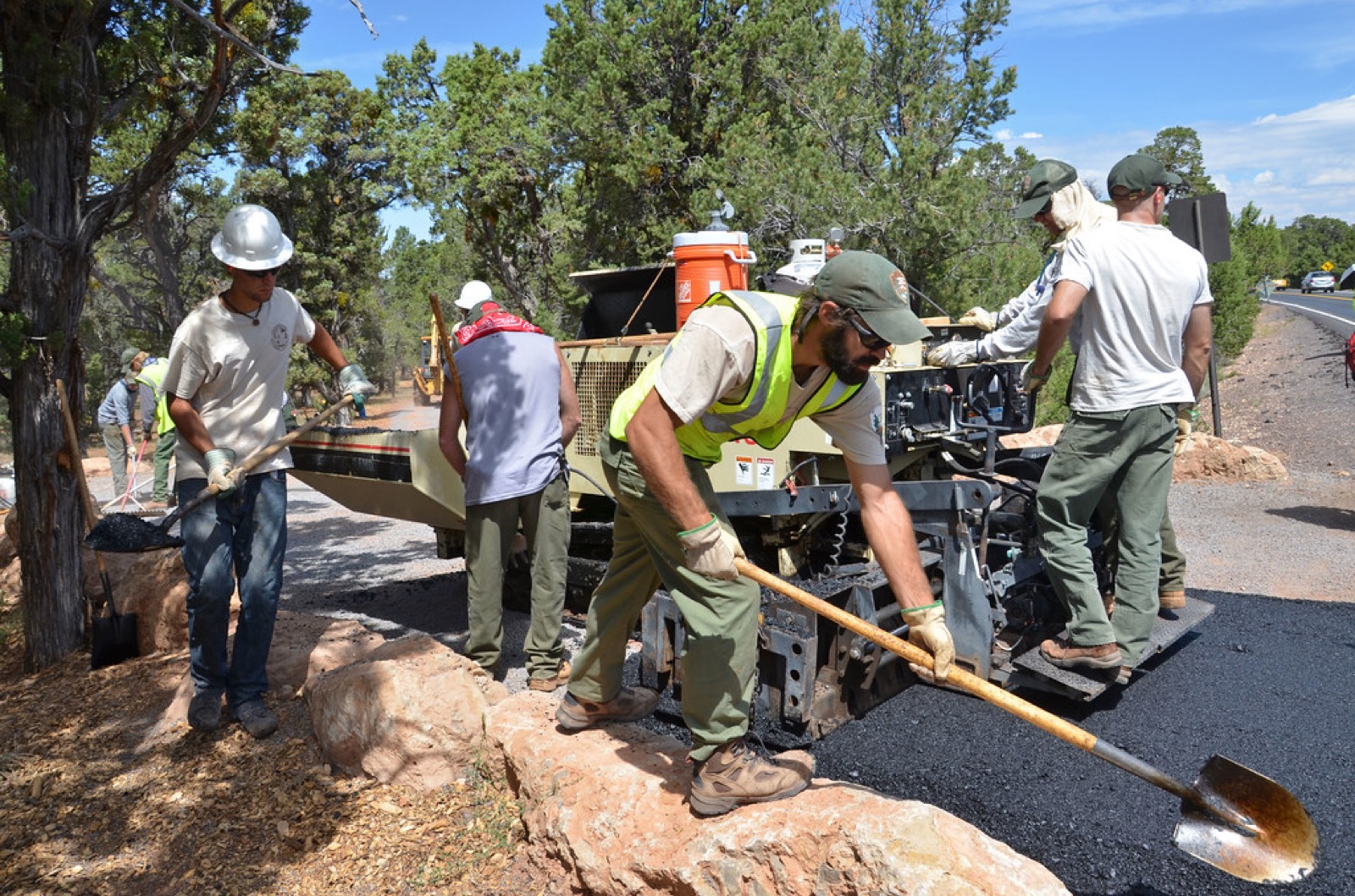 Infrastructure crew paving a road