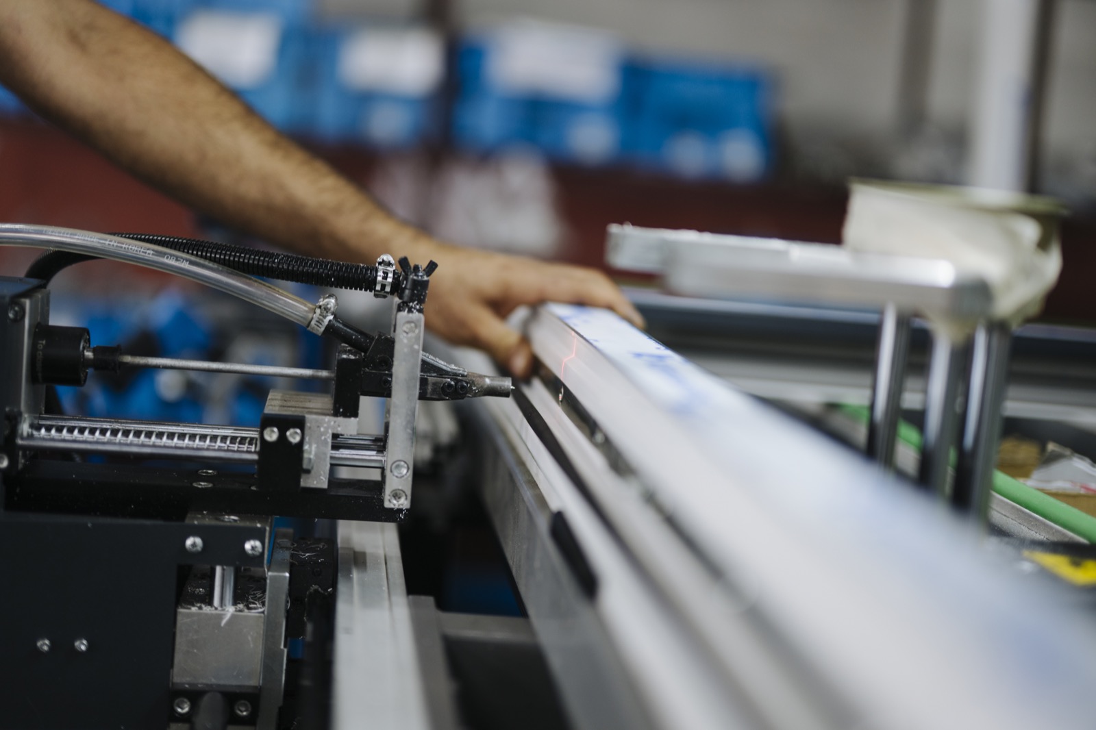 Worker operating machinery on a manufacturing production line